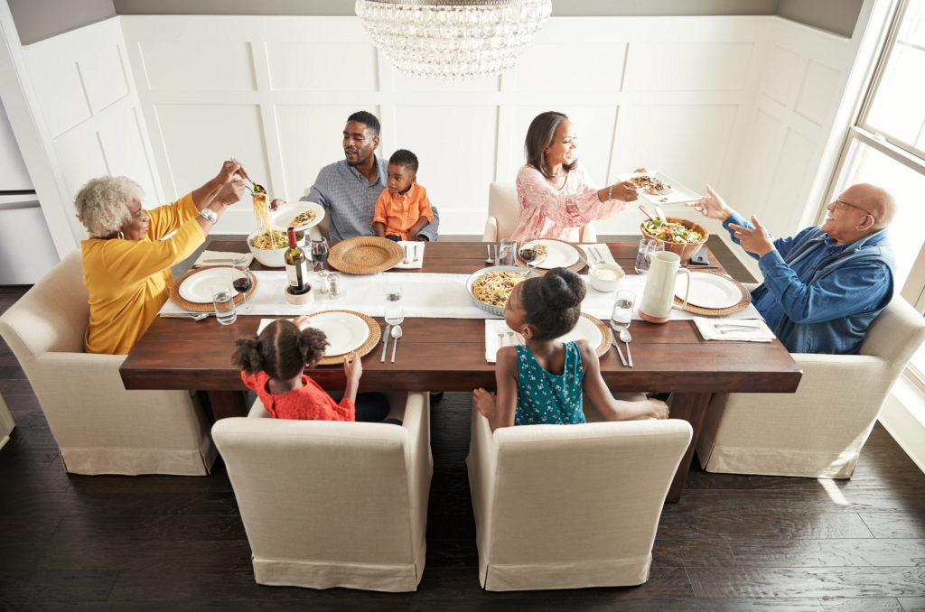 Happy family enjoying break fast | Hauptman Floor Covering Co Inc